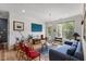 Inviting living room with a balcony view and ample natural light, perfect for relaxing or entertaining at 800 Savannah Ridge Rd # 109, Holly Springs, NC 27540