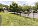 Spacious backyard with black metal fence and manicured lawn at 8001 Strawberry Meadows St, Raleigh, NC 27613