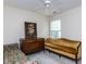 Cozy bedroom features classic antique furniture and comfortable couches at 8001 Strawberry Meadows St, Raleigh, NC 27613