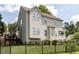 Backyard view of beautiful home features a black metal fence at 8001 Strawberry Meadows St, Raleigh, NC 27613