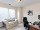 Bright office space features a comfortable armchair, modern art, and sleek desk at 8001 Strawberry Meadows St, Raleigh, NC 27613