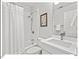 Cozy bathroom featuring a shower-tub combo and a modern sink with a vanity at 805 N Columbia St, Chapel Hill, NC 27516