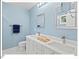 Bright bathroom featuring double sinks, white cabinets, and silver fixtures at 805 N Columbia St, Chapel Hill, NC 27516