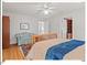 Cozy bedroom featuring wood flooring, ceiling fan, and comfortable seating at 805 N Columbia St, Chapel Hill, NC 27516