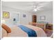 Cozy bedroom featuring light walls, a ceiling fan, and an ensuite bathroom for added convenience at 805 N Columbia St, Chapel Hill, NC 27516