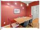Cozy dining room with hardwood floors, stylish lighting, and seating for six at 805 N Columbia St, Chapel Hill, NC 27516