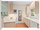 Well-lit kitchen featuring modern appliances, neutral cabinetry, and a seamless design at 805 N Columbia St, Chapel Hill, NC 27516