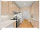 Kitchen featuring modern appliances, ample cabinet space, and hardwood flooring at 805 N Columbia St, Chapel Hill, NC 27516