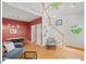 Bright open-concept living room with hardwood floors and a view of the staircase at 805 N Columbia St, Chapel Hill, NC 27516