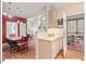 Bright open space showcases hardwood floors, with dining leading to an outdoor screened porch at 805 N Columbia St, Chapel Hill, NC 27516