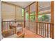 Charming screened porch featuring wooden frame and comfortable seating, with views of nature at 805 N Columbia St, Chapel Hill, NC 27516