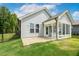 Exterior view of the home with a fenced-in yard and relaxing outdoor space at 8217 White Star Dr, Fuquay Varina, NC 27526