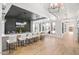 Entertainment area with a stylish bar and a long counter with seating for casual dining and socializing at 8217 White Star Dr, Fuquay Varina, NC 27526