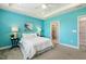 Brightly painted bedroom with carpet and connecting bathroom with glass shower door at 8217 White Star Dr, Fuquay Varina, NC 27526