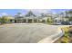 Exterior of the community clubhouse featuring ample parking and landscaping at 8217 White Star Dr, Fuquay Varina, NC 27526