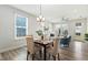 The dining room offers natural light and stylish decor, perfect for Gathering meals and entertaining at 8217 White Star Dr, Fuquay Varina, NC 27526