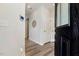 Welcoming foyer with hardwood floors and a view of the home's smart home technology at 8217 White Star Dr, Fuquay Varina, NC 27526