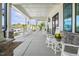 Charming covered porch with rocking chairs offers a relaxing outdoor space with neighborhood views at 8217 White Star Dr, Fuquay Varina, NC 27526