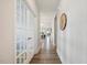Bright hallway with beautiful hardwood floors and french doors leading to another room at 8217 White Star Dr, Fuquay Varina, NC 27526
