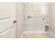 Bright laundry room featuring tile flooring at 8217 White Star Dr, Fuquay Varina, NC 27526