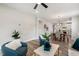 Open concept living area with wood floors, a dining area and view to the kitchen at 8217 White Star Dr, Fuquay Varina, NC 27526