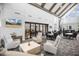 Bright lobby with comfortable seating, tv, and dining tables for entertaining guests in a relaxing and inviting atmosphere at 8217 White Star Dr, Fuquay Varina, NC 27526