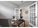 Office with wood floors, a modern desk, a globe, and French doors leading to another room at 8217 White Star Dr, Fuquay Varina, NC 27526