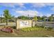 Entrance to Magnolia Manor featuring lush landscaping and a welcoming sign at 8217 White Star Dr, Fuquay Varina, NC 27526