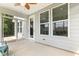 Relaxing sunroom with ceiling fan, natural light, and screened windows at 8217 White Star Dr, Fuquay Varina, NC 27526