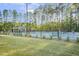 Outdoor tennis courts surrounded by lush trees, and green spaces providing a serene and active recreational area at 8217 White Star Dr, Fuquay Varina, NC 27526