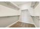 Walk-in closet featuring carpet flooring and shelving at 8217 White Star Dr, Fuquay Varina, NC 27526