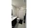 Nicely appointed bathroom with modern black vanity, toilet, and shower at 8680 Kenridge Ln, Fuquay Varina, NC 27526