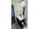 Bathroom with a black vanity and white countertop sink at 8680 Kenridge Ln, Fuquay Varina, NC 27526