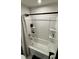 Clean bathroom featuring a tub shower with built-in shelving at 8680 Kenridge Ln, Fuquay Varina, NC 27526