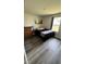 Comfortable bedroom with natural light, complemented by wood-look laminate flooring at 8680 Kenridge Ln, Fuquay Varina, NC 27526