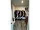 Walk-in closet with hanging clothes, shelving, and wood-look flooring at 8680 Kenridge Ln, Fuquay Varina, NC 27526
