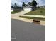 Street view of a home with a large manicured lawn, a two-car garage, and a sidewalk at 8680 Kenridge Ln, Fuquay Varina, NC 27526