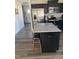 Beautiful kitchen with stainless steel appliances, granite countertops, and a breakfast bar with seating at 8680 Kenridge Ln, Fuquay Varina, NC 27526