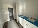 Bathroom featuring a double sink vanity with white cabinets at 88 W Emily Gardens Dr, Selma, NC 27576