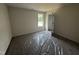 A bright carpeted bedroom offering ample natural light at 88 W Emily Gardens Dr, Selma, NC 27576