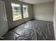A bright carpeted bedroom offering natural light at 88 W Emily Gardens Dr, Selma, NC 27576