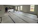 Open living space with white kitchen cabinets and ample natural light at 88 W Emily Gardens Dr, Selma, NC 27576