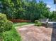 Charming backyard featuring a brick patio, perfect for outdoor gatherings and enjoyment at 8828 Deerland Grove Dr, Raleigh, NC 27615