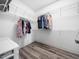 Organized walk-in closet with ample storage space and shelving at 8828 Deerland Grove Dr, Raleigh, NC 27615