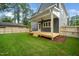 Spacious backyard with a wooden deck and a ceiling fan in a charming home at 905 Deboy St, Raleigh, NC 27606