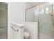 Bathroom featuring a glass-enclosed shower with marble tiling and modern fixtures at 905 Deboy St, Raleigh, NC 27606