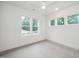 Bright, carpeted bedroom with three windows providing ample natural light at 905 Deboy St, Raleigh, NC 27606