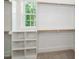 Walk-in closet featuring built-in shelving and a window at 905 Deboy St, Raleigh, NC 27606