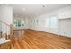 Spacious living room with hardwood floors, white trim, and an abundance of windows for natural light at 905 Deboy St, Raleigh, NC 27606