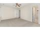 Bedroom with neutral walls, carpet, double closets, and ensuite bathroom at 9709 Batesville Dr, Raleigh, NC 27617